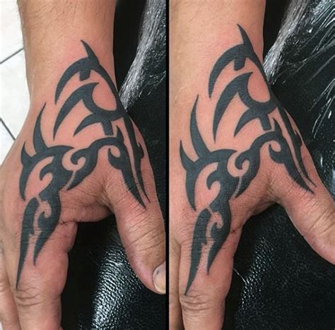 hand tattoos for men|tribal hand tattoos for men.